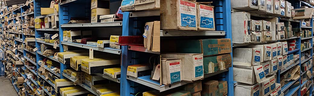 NOS (New Old Stock) parts inventoried on the shelves at All American Classics